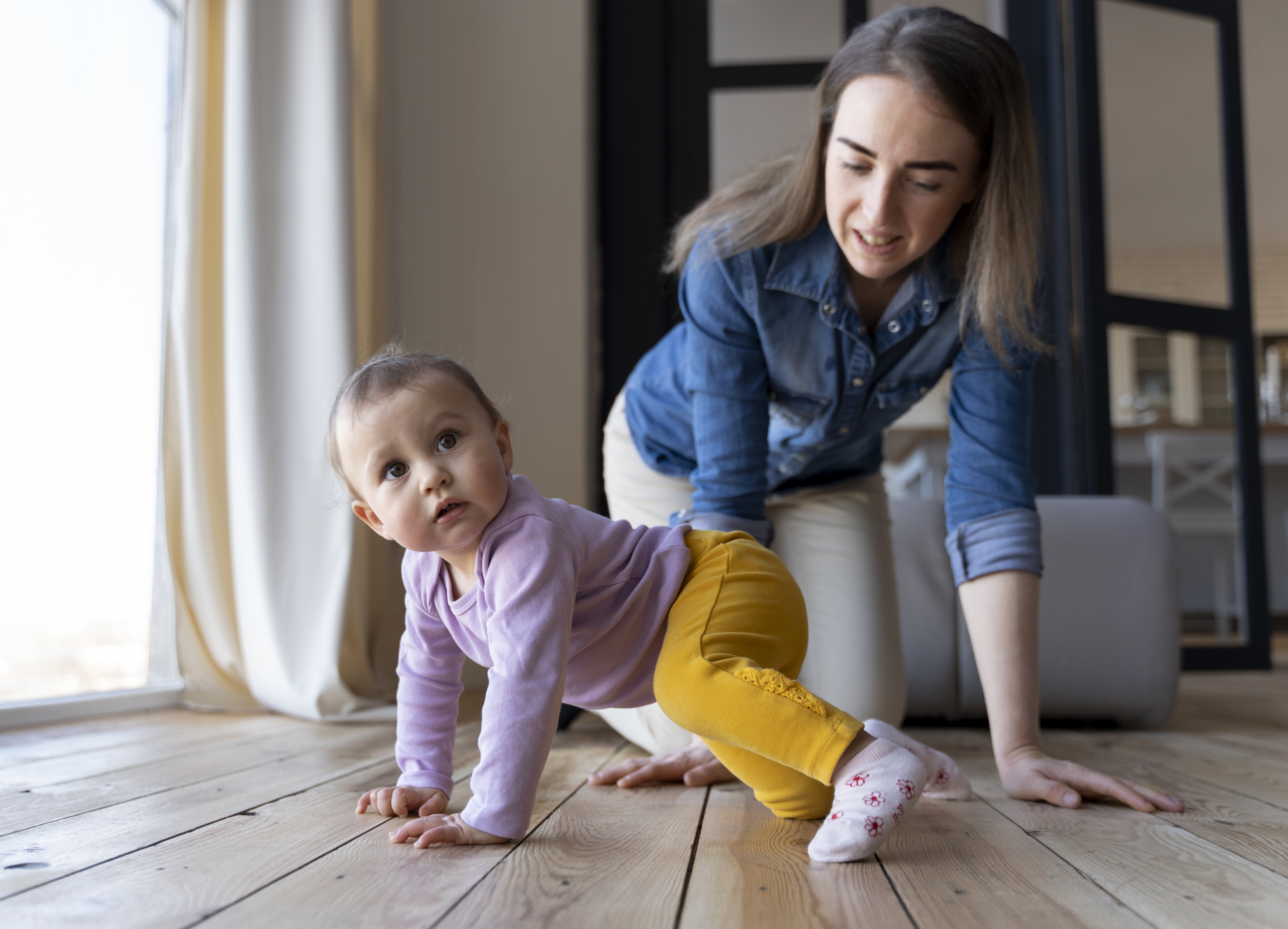 baby-crawling-with-his-mother-s-help